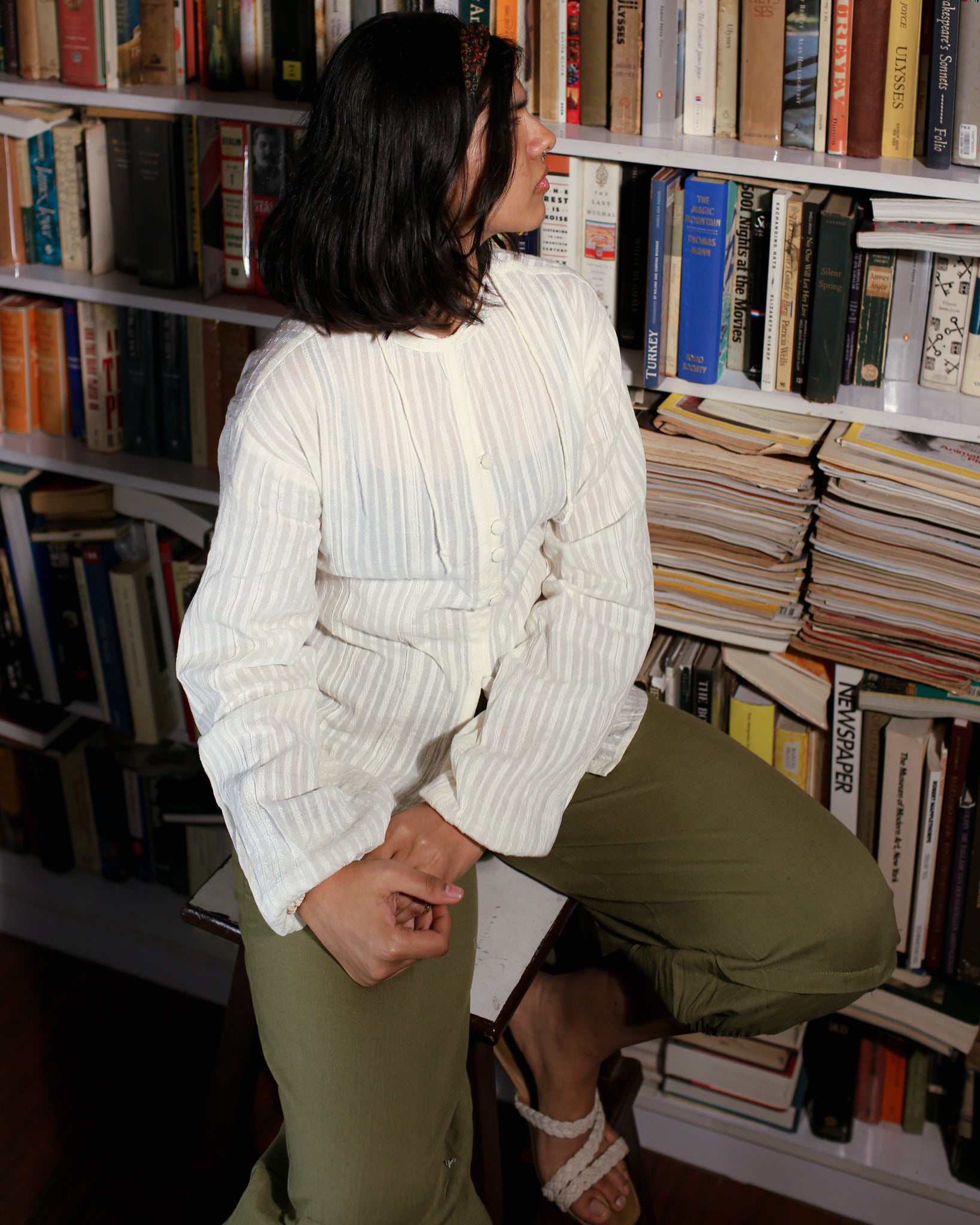 Back view of ivory dobby cotton blouse showing adjustable waist tie and pintucked detailing