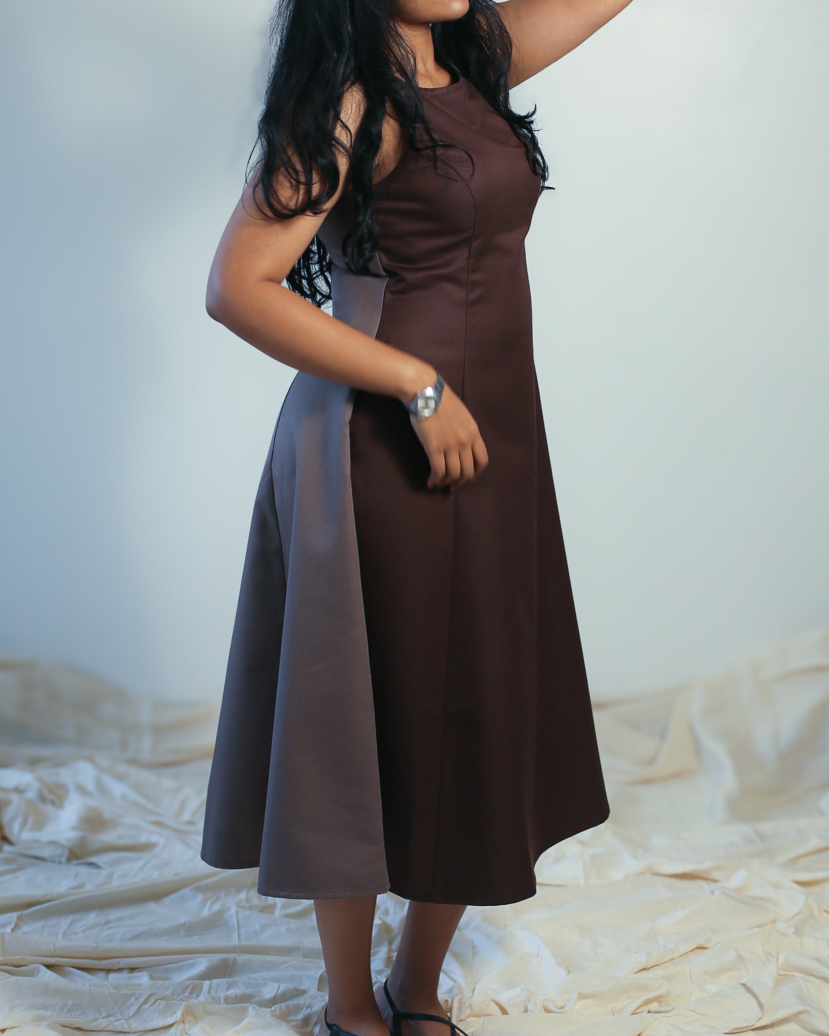 Side view of Dual-shade fit & flare midi dress in coffee brown and taupe