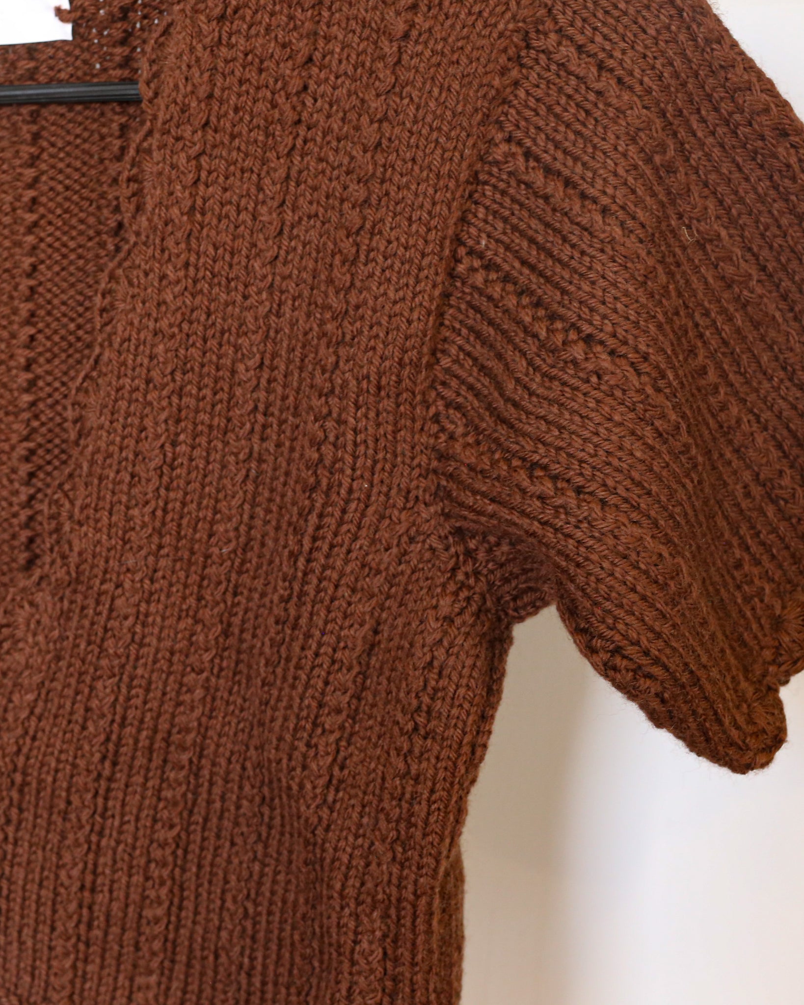 Intricate knit of 100% pure wool sweater top.