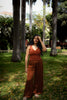 Full view of burnt ochre earthy cotton top paired with flowy trousers, ideal for breathable summer styling.
