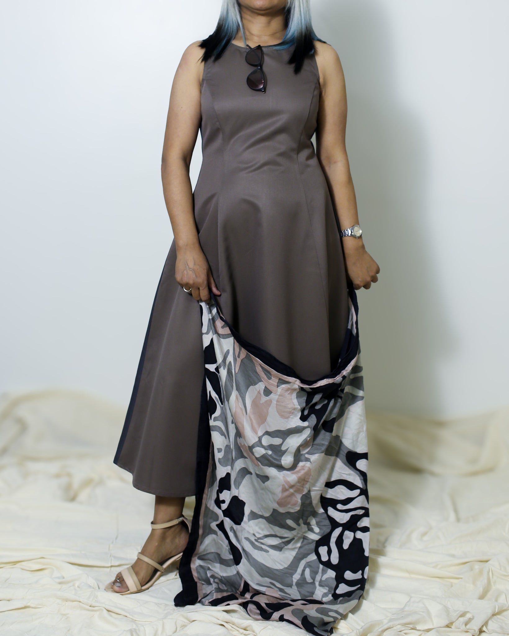 Dual-shade fit & flare midi dress in coffee brown and taupe, with a flattering waist fit, styled with a silver watch.
