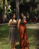 Two women in different age groups wearing earthy toned cotton tops, styled with saree and trousers.