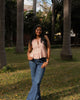 Casual summer outfit with cotton pleated peplum top paired with jeans, breathable everyday wear