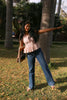 Flowy cotton peplum top in motion showing soft drape and relaxed fit for everyday comfort