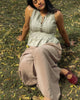 Flowy cotton peplum top in motion highlighting soft drape and airy summer feel