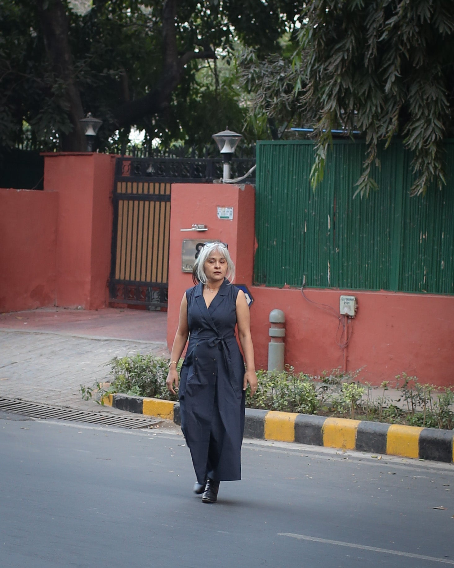 City‑ready trench dress in midnight blue with classic tailoring and minimal design