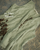 Close-up of soft textured cotton fabric with fine pleats and natural flowy finish for colour reference