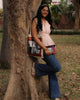 wood & pleat cotton top for women in dusty blush with wooden buttons, sleeveless peplum fit, styled casually outdoors