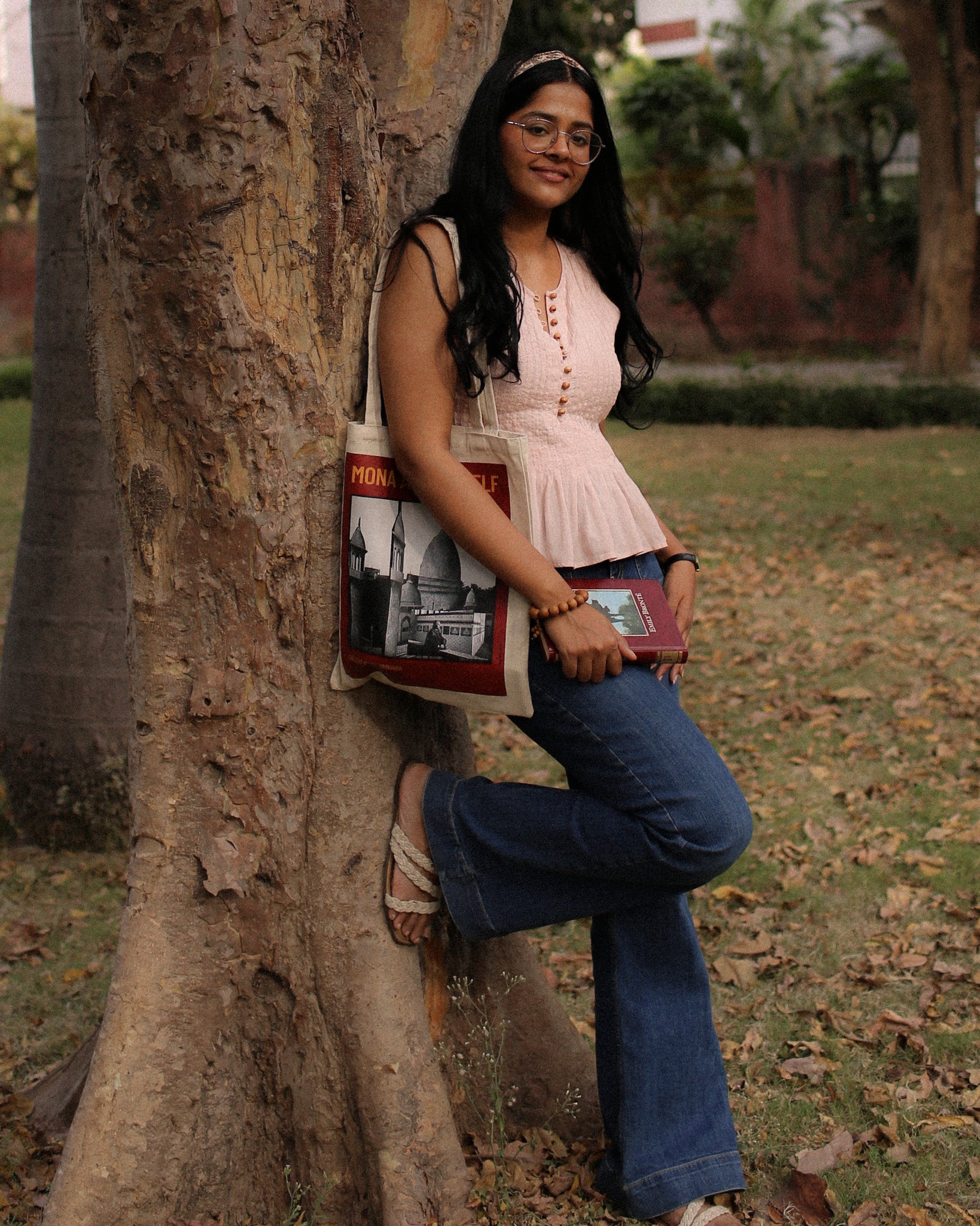 wood & pleat cotton top for women in dusty blush with wooden buttons, sleeveless peplum fit, styled casually outdoors